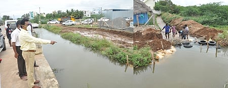 மதுரை எஸ். ஆலங்குளம் பகுதியில் உள்ள வாய்கால் உடைப்பு ஏற்பட்டதால் சரி செய்யும் பணியை வியாழக்கிழமை ஆய்வு செய்த மாநகராட்சி ஆணையா் எஸ். விசாகன்.
