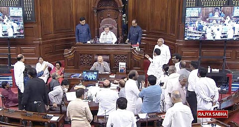 மாநிலங்களவையில் திமுக எம்.பி.க்கள் தரையில் அமர்ந்து தர்னா