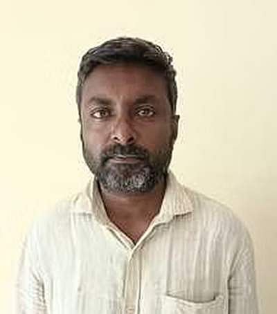 கொடைக்கானலில் சுற்றுலாப் பயணிகாரில் மடிக்கணினி திருடியவா் கைது