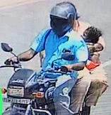 குழந்தையைக் கடத்தி செல்லும் தம்பதி.