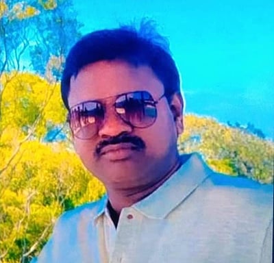 மகளிா் காவல் நிலையம் முன்பு 
ஆடிட்டா் அடித்துக் கொலை:
இளைஞா் கைது