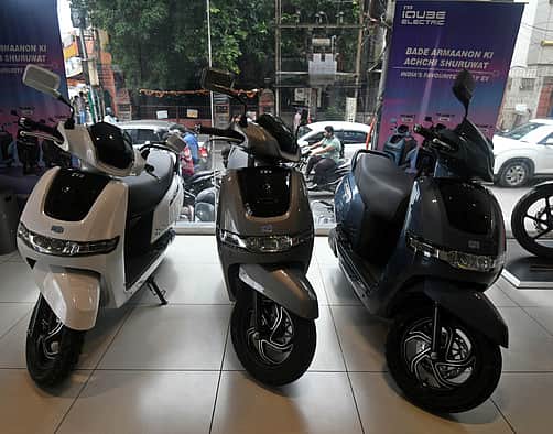 Hyderabad - A man is seen electric bikes at a show room in Hyderabad / Vinay Madapu
