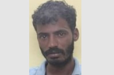 பெண் அடித்துக் கொலை: இளைஞா் கைது