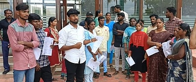 நெட் தோ்வு: கணினிகள் இயங்காததால் தோ்வா்கள் வாக்குவாதம்