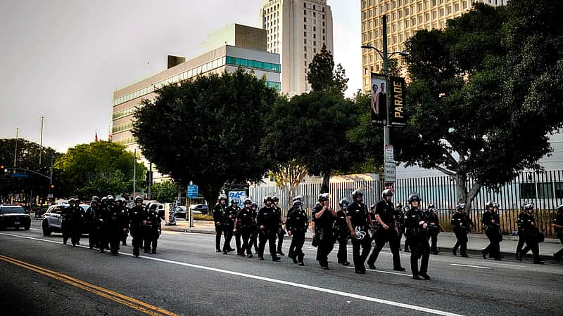 A Los Angeles police officers clear a street near Los Angeles City Hall in downtown