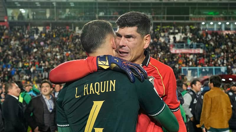 Bolivia's goalkeeper Carlos Lampe and teammate Luis Haquin celebrate their team's 1-0 victory over Brazil at the end of a World Cup 2026 qualifying