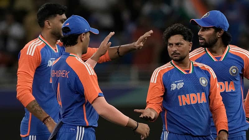 India's Kuldeep Yadav, second right, celebrate the wicket of United Arab Emirates's Rahul Chopra during the Asia Cup