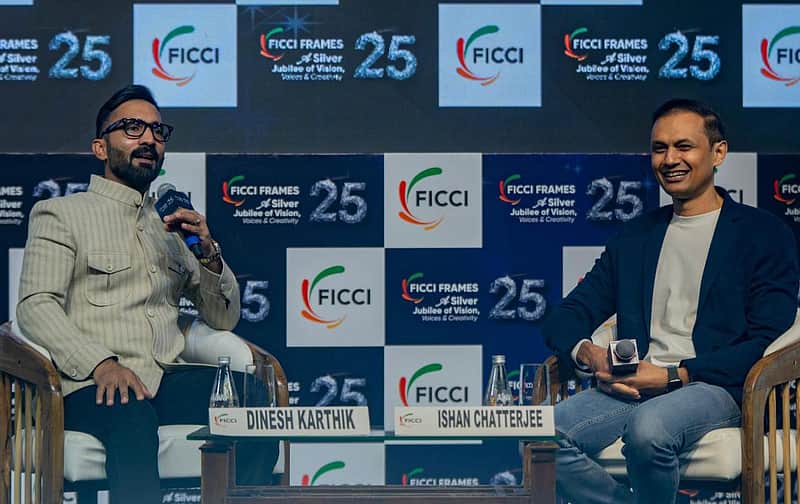 Ishan Chatterjee with Dinesh Karthik.