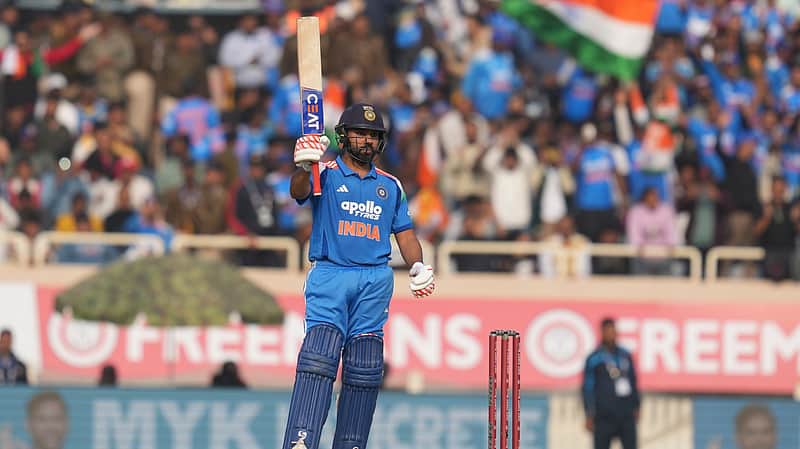 Rohit Sharma celebrates after scoring a half-century