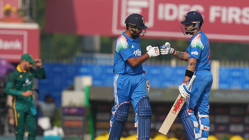 India's Virat Kohli , right, and India's Rohit Sharma give the fist after scoring runs during the first One Day International match between India and South Africa in Ranchi,