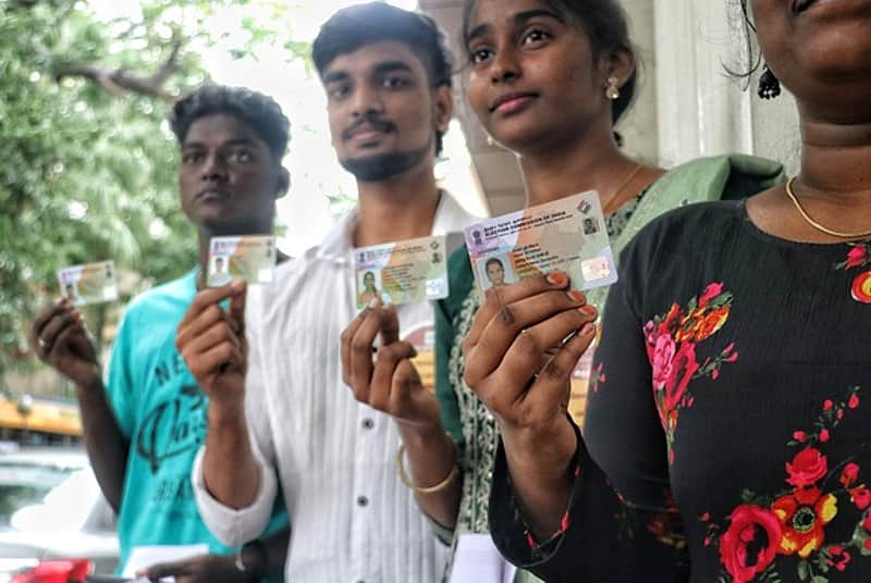 25/01/2026, TN, PONDICHERRY: First-time voters display their voter ID cards during the 16th National Voters' Day celebrations at Kamban Kalaiarangam o