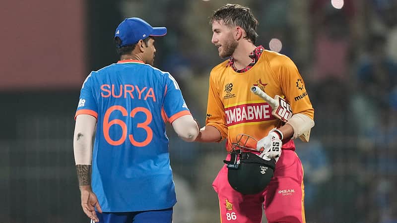India's captain Suryakumar Yadav, left, shake hands with Zimbabwe's Brian Bennett after winning the T20 World Cup cricket match between India and Zimbabwe in Chennai, India, Thursday, Feb. 26, 2026. (AP Photo/Mahesh Kumar A.)