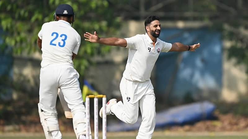 Auqib Nabi Dar is happy to have taken a wicket.