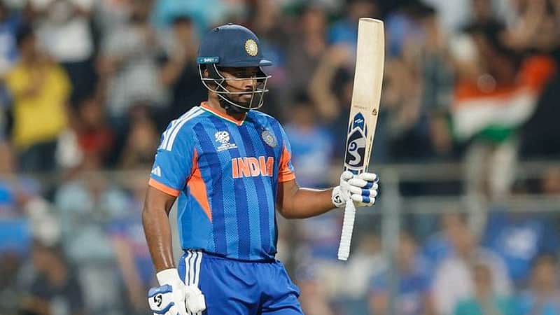 Sanju Samson celebrates after scoring a half-century