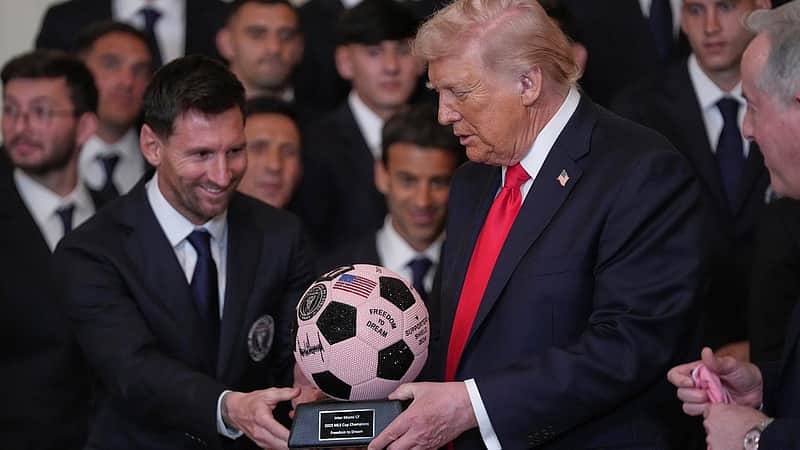 President Donald Trump receives a soccer ball trophy from Lionel Messi during an event to honor the 2025 Major League Soccer champions Inter Miami in the East Room of the White House, Thursday, March 5, 2026, in Washington. (AP Photo/Julia Demaree Nikhinson)