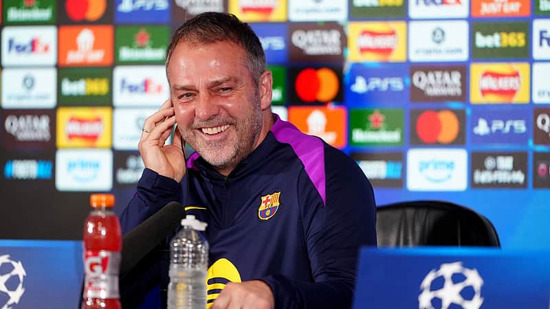 Barcelona manager Hansi Flick smiles during a press conference at St. James' Park, Newcastle upon Tyne, England, Monday March 9, 2026, ahead of the Champions League soccer match between Newcastle United and Barcelona on Tuesday. (Owen Humphreys/PA via AP)