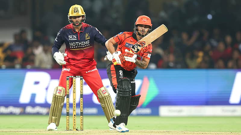 Ishan Kishan drives the ball for a boundary.