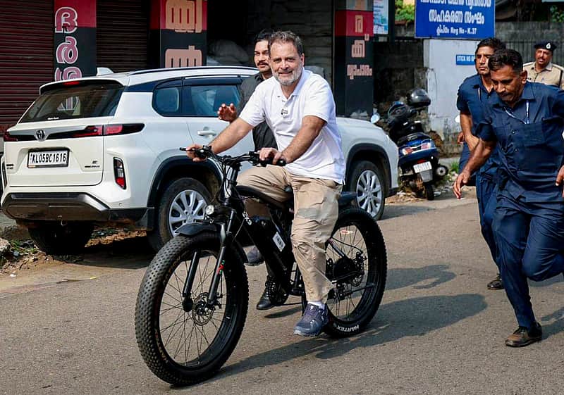 Congress leader Rahul Gandhi rides a bicycle as he campaigns in support of UDF candidates for the upcoming Kerala Assembly elections, in Kottayam district.