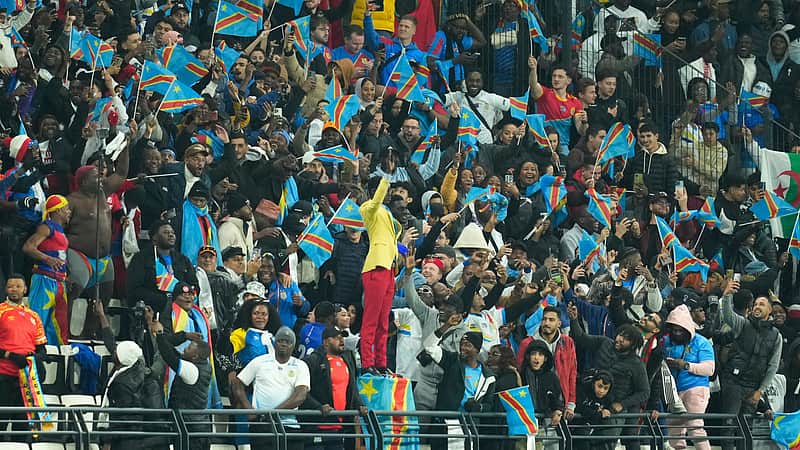 FILE - Michel Nkuka Mboladinga, a DR Congo fan impersonating late Congolese leader Patrice Lumumba, strikes a pose during the Africa Cup of Nations group D soccer match between Botswana and DR Congo in Rabat, Morocco, Tuesday, Dec. 30, 2025. (AP Photo/Mosa'ab Elshamy, File)