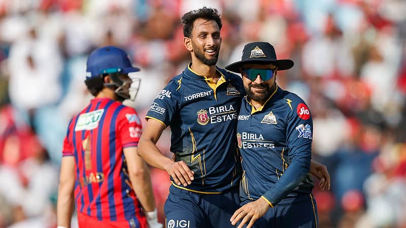 Prasidh Krishna sharing the joy of taking a wicket with Rashid Khan.