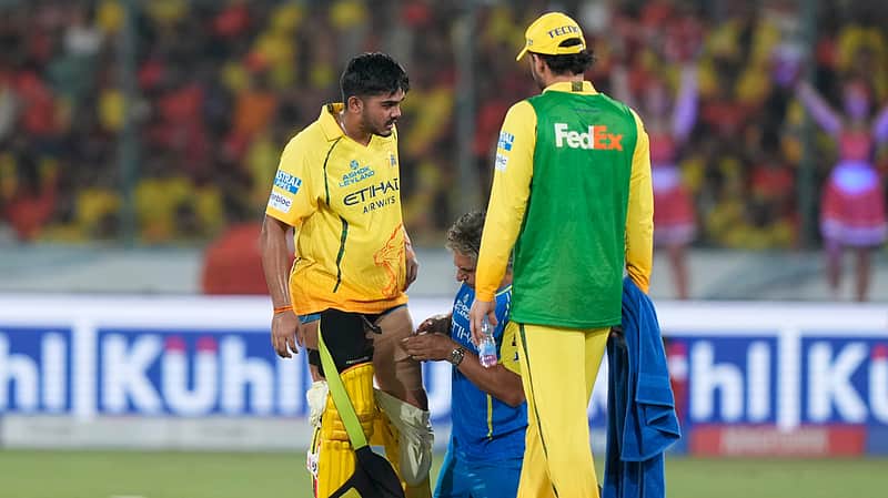 A physio attend Chennai Super Kings' Ayush Mhatre, left, during the Indian Premier League cricket match between Sunrisers Hyderabad and Chennai Super Kings in Hyderabad, India, Saturday, April 18, 2026. (AP Photo/Mahesh Kumar A.)