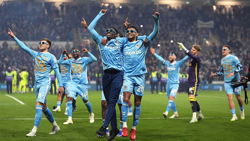 Coventry City players celebrate sealing the league title following the EFL Championship soccer match between Coventry City and Portsmouth, Tuesday, April 21, 2026 in Coventry, England. (Mike Egerton/PA via AP)