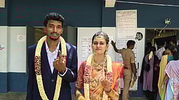 ஓமலூா் அருகே மணக்கோலத்தில் வாக்களித்த தம்பதி