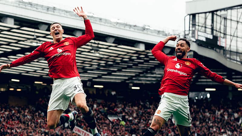 The Manchester United players celebrating the goal.