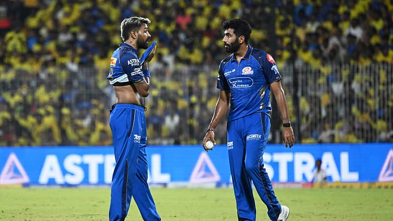 Mumbai Indians' captain Hardik Pandya, left, has a word with bowler Jasprit Bumrah during the Indian Premier League cricket match between Chennai Super Kings and Mumbai Indians in Chennai, India, Saturday, May 2, 2026. (AP Photo)