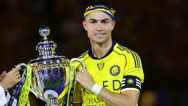 Nassr's Portuguese forward #07 Cristiano Ronaldo poses with the trophy after winning the Saudi Pro League title at the end of the football match against Damac at the Al-Awwal Park Stadium in Riyadh on May 21, 2026. (Photo by Fayez NURELDINE / AFP)