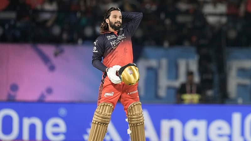 Royal Challengers Bengaluru's captain Rajat Patidar reacts after hitting a six during the Indian Premier League cricket match between Gujarat Titans and Royal Challengers Bengaluru in Dharamshala, India, Tuesday, May 26, 2026. (AP Photo/Ashwini Bhatia)