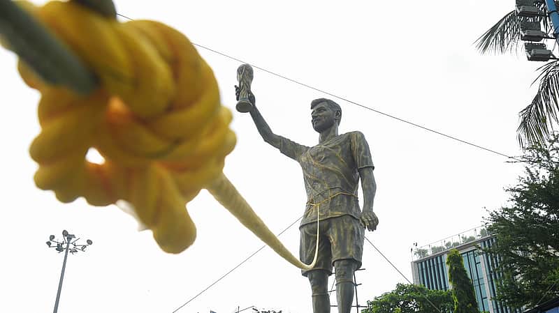 Statue of Lionel Messi tied with ropes for stability amid rain and thunderstorms, in Kolkata on Wednesday. (ANI Photo)