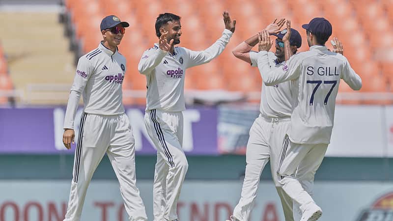 Indian players rejoicing after taking a wicket.
