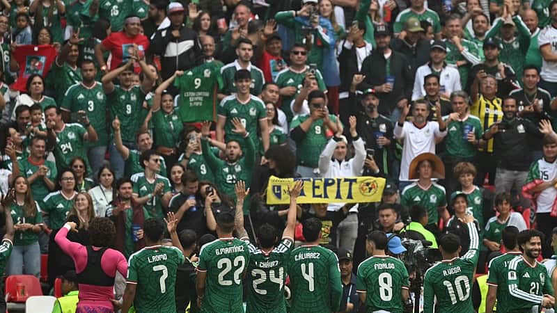 Mexico's players celebrate in front of fans after winnig the 2026 World Cup Group A football match between Mexico and South Africa at the Mexico City Stadium in Mexico City on June 11, 2026. (Photo by Yuri CORTEZ / AFP)