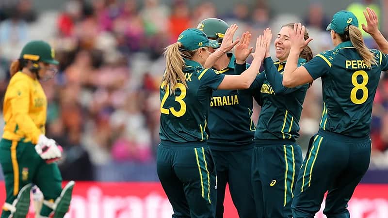 The Australian women's team rejoicing after taking a wicket.