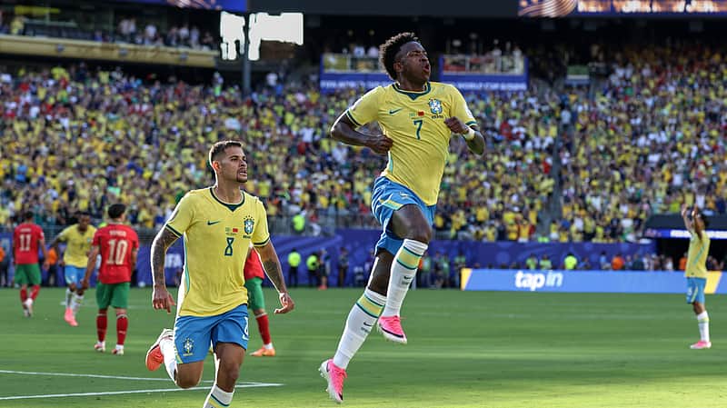 Brazil's Vinicius Junior (7) celebrates with teammate Bruno Guimaraes (8) after scoring during the World Cup Group C soccer match against Morocco in East Rutherford, N.J., near New York, Saturday, June 13, 2026. (AP Photo/Matt Slocum)