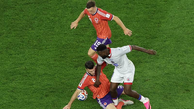 Haiti's Frantzdy Pierrot (20) battles for the ball with Scotland's Grant Hanley (5) during the World Cup Group C soccer match between Haiti and Scotland in Foxborough, Mass., near Boston, Saturday, June 13, 2026. (AP Photo/Mark Stockwell)