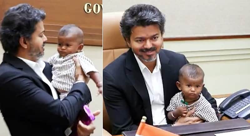 CM Vijay happily cuddles a child at the Chennai Secretariat