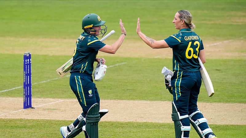 Beth Mooney, left, and Ashleigh Gardner of Australia celebrate a 100 partnership during the Women's T20 World Cup match between Australia and Netherlands in Southampton, England, Saturday June 20, 2026. (Andrew Matthews/PA via AP)