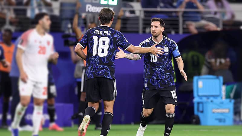 Argentina's Lionel Messi (10) shakes hands with Nico Paz (18) after subbing in during the World Cup Group J soccer match between Jordan and Argentina in Arlington, Texas, near Dallas, Saturday, June 27, 2026. (AP Photo/Sam Hodde)