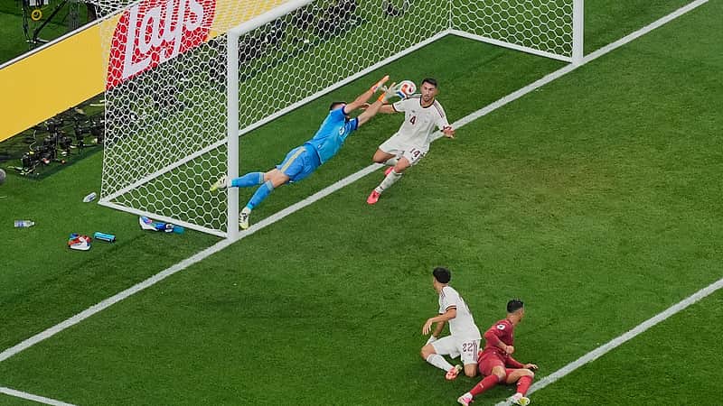 Spain goalkeeper Unai Simon (23) saves the ball during the World Cup round of 16 soccer match between Portugal and Spain in Arlington, Texas, near Dallas, Monday, July 6, 2026. (AP Photo/Jessica Tobias)