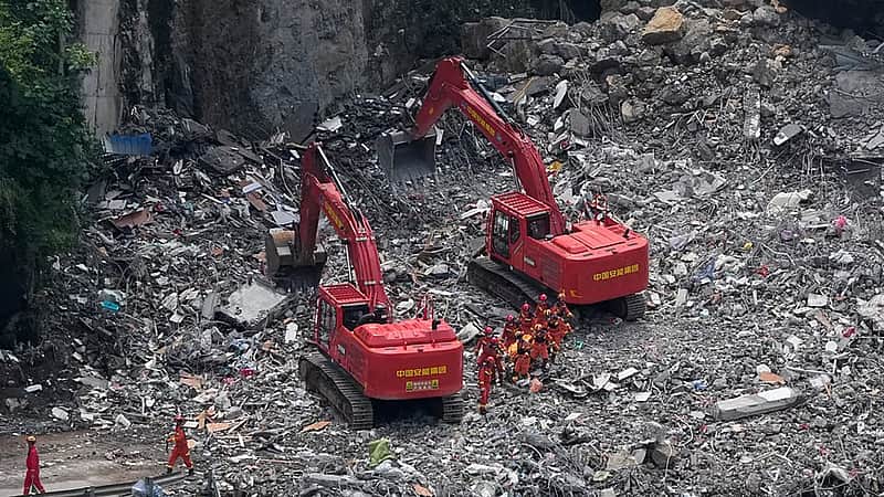 Rescuers in China search the rubble for survivors of landslide...