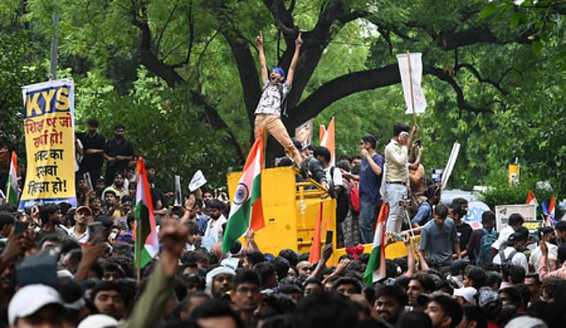 <P>Cockroach Janata Party (CJP) supporters raise slogans as they gather ahead of a protest march, at the Jantar Mantar, in New Delhi, early Monday, Ju