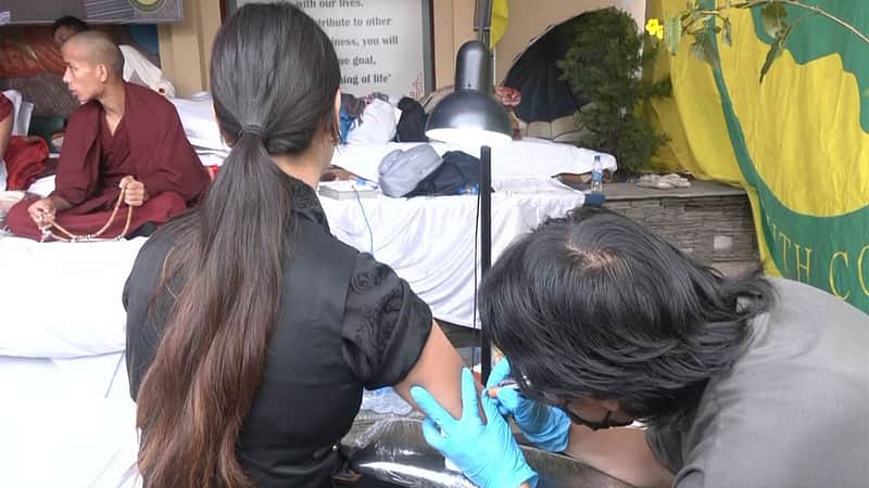 tibetians tattoo protest