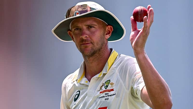 Australian bowler Josh Hazlewood holds the ball aloft after taking six Bangladesh wickets on the third day of the first cricket Test match between Australia and Bangladesh at Marrara Stadium in Darwin on August 15, 2026. (Photo by William WEST / AFP)