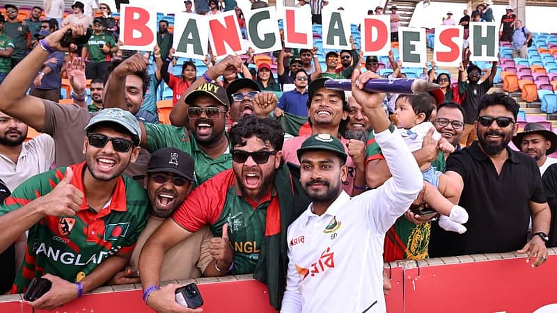 Bangladesh player Mehidy Hasan Miraz poses with fans after victory against Australia on the fourth day of the first cricket Test match between Australia and Bangladesh at Marrara Stadium in Darwin on August 16, 2026. (Photo by William WEST / AFP)