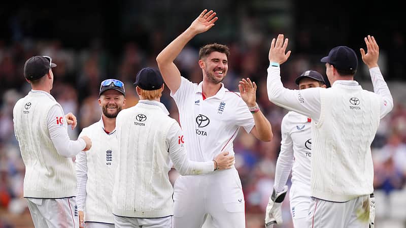 England players rejoicing after taking a wicket.