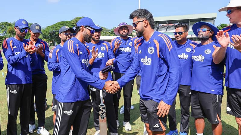 Ravindra Jadeja presents the Indian team cap to debutant Saransh Jain.