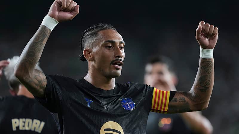Barcelona's Raphinha celebrates after scoring his side's third goal during a Spanish La Liga soccer match between Elche and Barcelona in Elche, Spain, Sunday, Aug. 23, 2026. (AP Photo/Alberto Saiz)