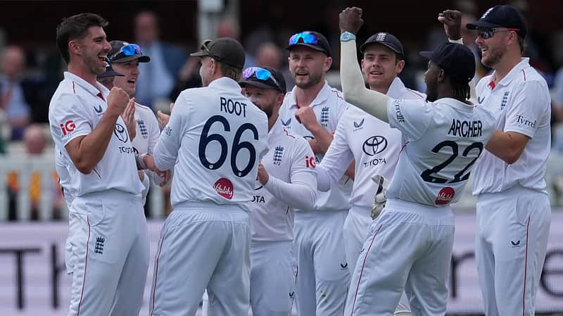 England team players rejoicing after taking a wicket.